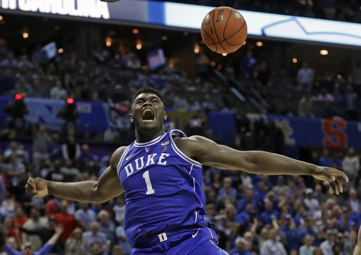 Duke's Zion Williamson reacts after a dunk against North Carolina on March 15