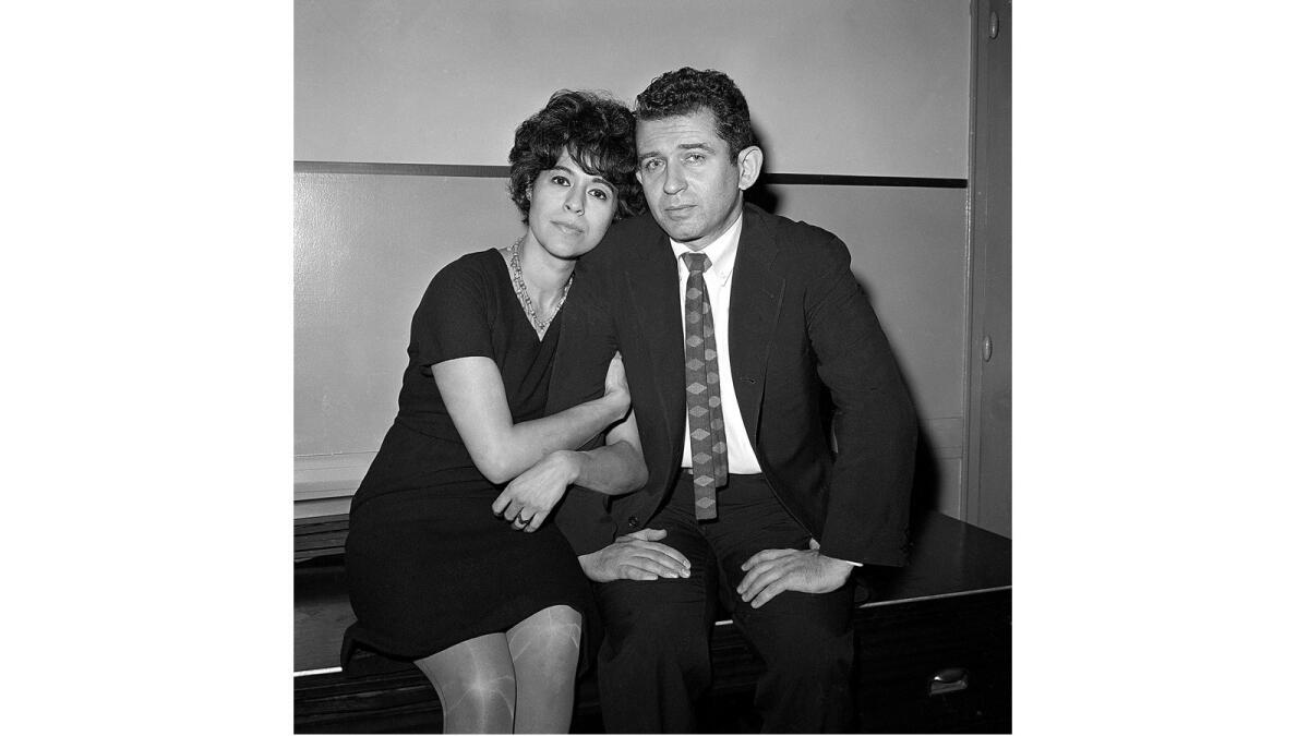 In this 1960 photo Adele Morales Mailer is shown sitting in court with then-husband Norman Mailer, wheh he faced charges that he stabbed her at a drunken party. She died Sunday at 90.