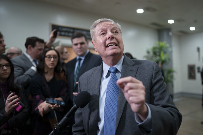Sen. Lindsey Graham (R-S.C.) speaks to reporters during a break in the impeachment trial of President Trump on Friday.