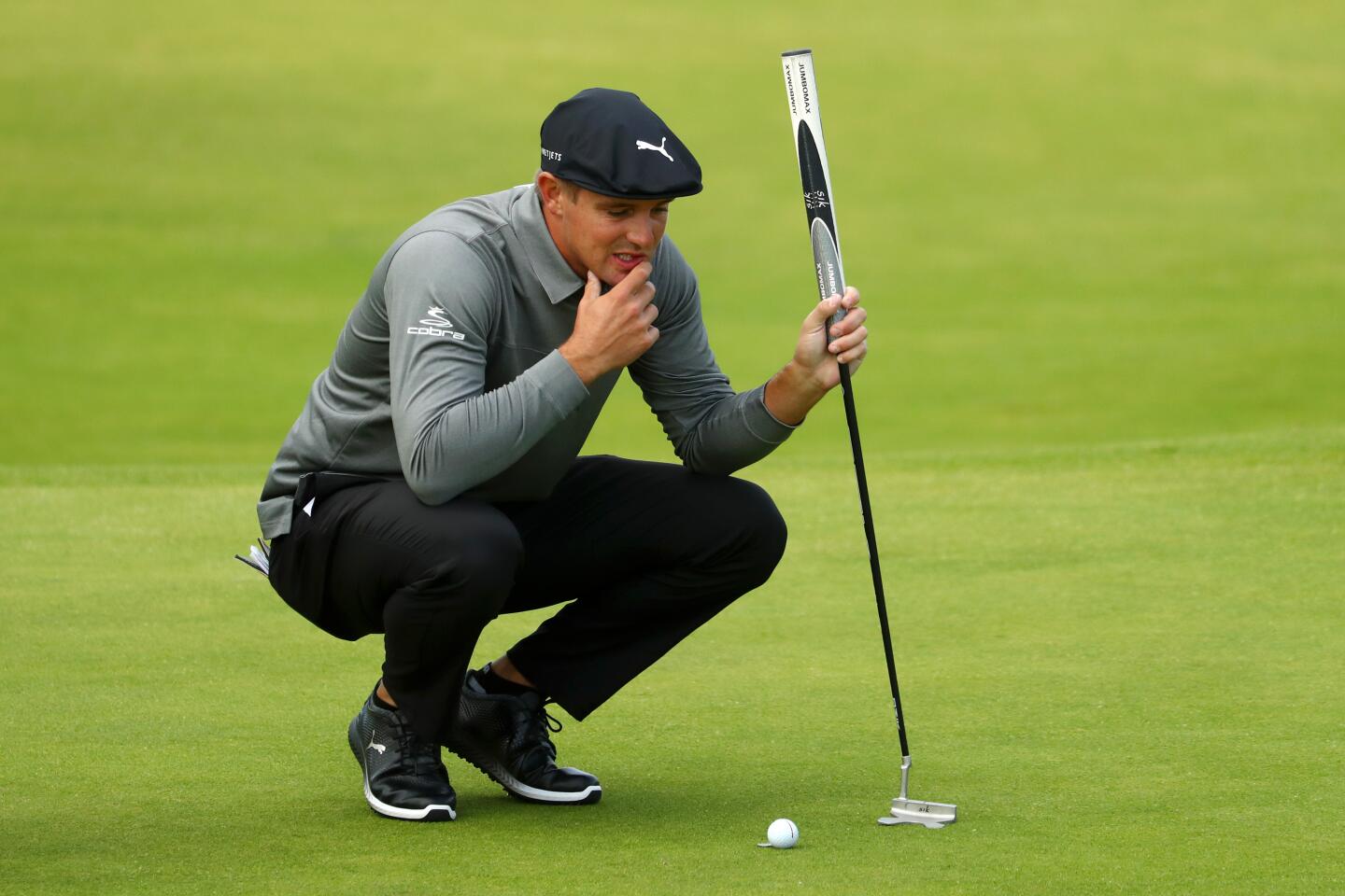 Bryson DeChambeau of the United States prepares to putt on the fourth green during the first round of the 148th Open Championship at Royal Portrush Golf Club in Northern Ireland.