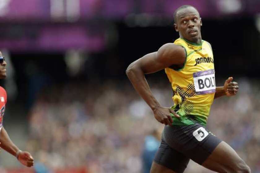 Usain Bolt competes in a men's 200-meter heat Tuesday.