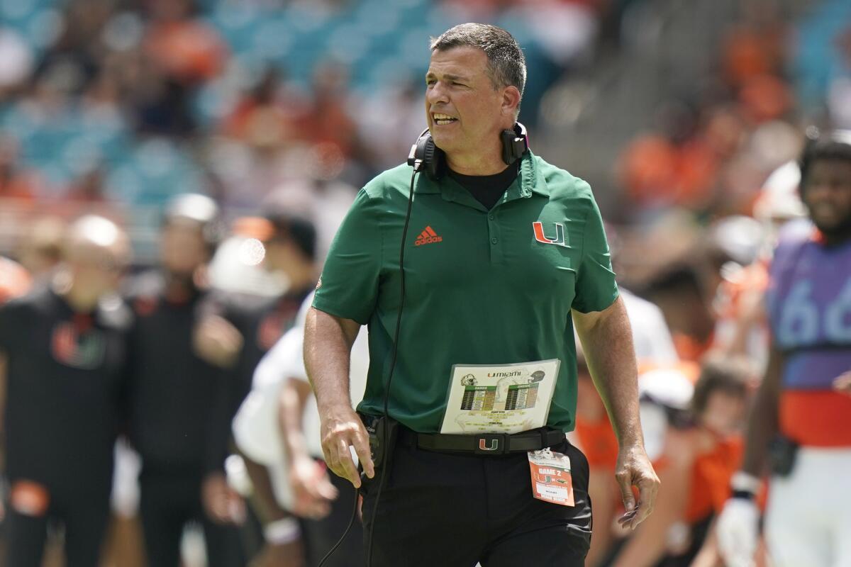 Miami head coach Mario Cristobal walks the sidelines during the first half of an NCAA college football game against Southern Miss, Saturday, Sept. 10, 2022, in Miami Gardens, Fla. (AP Photo/Wilfredo Lee)