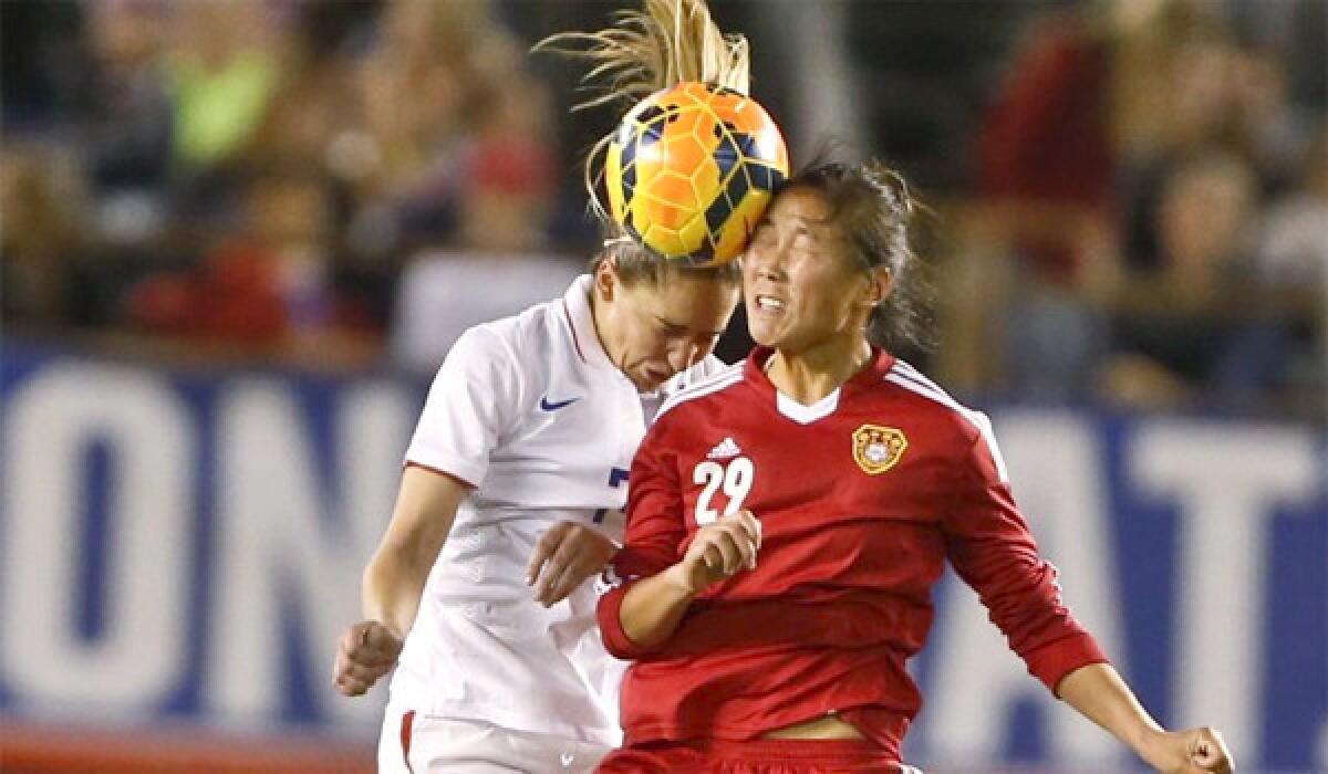 U.S. midfielder Morgan Brian and China forward Yang Li battle for a head ball during the United States' 3-0 win over China on Thursday at Qualcomm Stadium in San Diego.