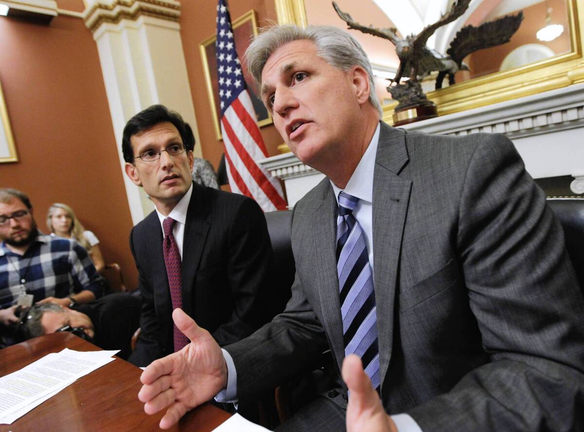 House Majority Whip Kevin McCarthy speaks to reporters last month as Eric Cantor, the House majority leader, looks on. McCarthy and Cantor are among the GOP's "young guns" who have helped get tea-party-backed candidates elected since 2010.