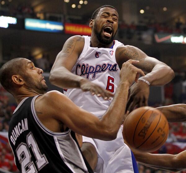 Clippers center DeAndre Jordan is blocked by the Spurs Tim Duncan