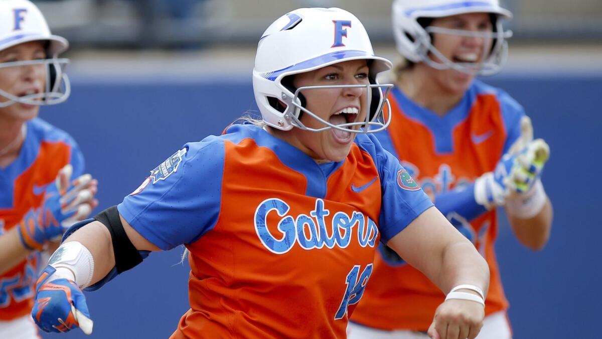 Florida's Amanda Lorenz celebrates a run during a Women's College World Series game against Washington in 2017. Lorenz is one of many Southern California-raised players competing in this year's tournament.