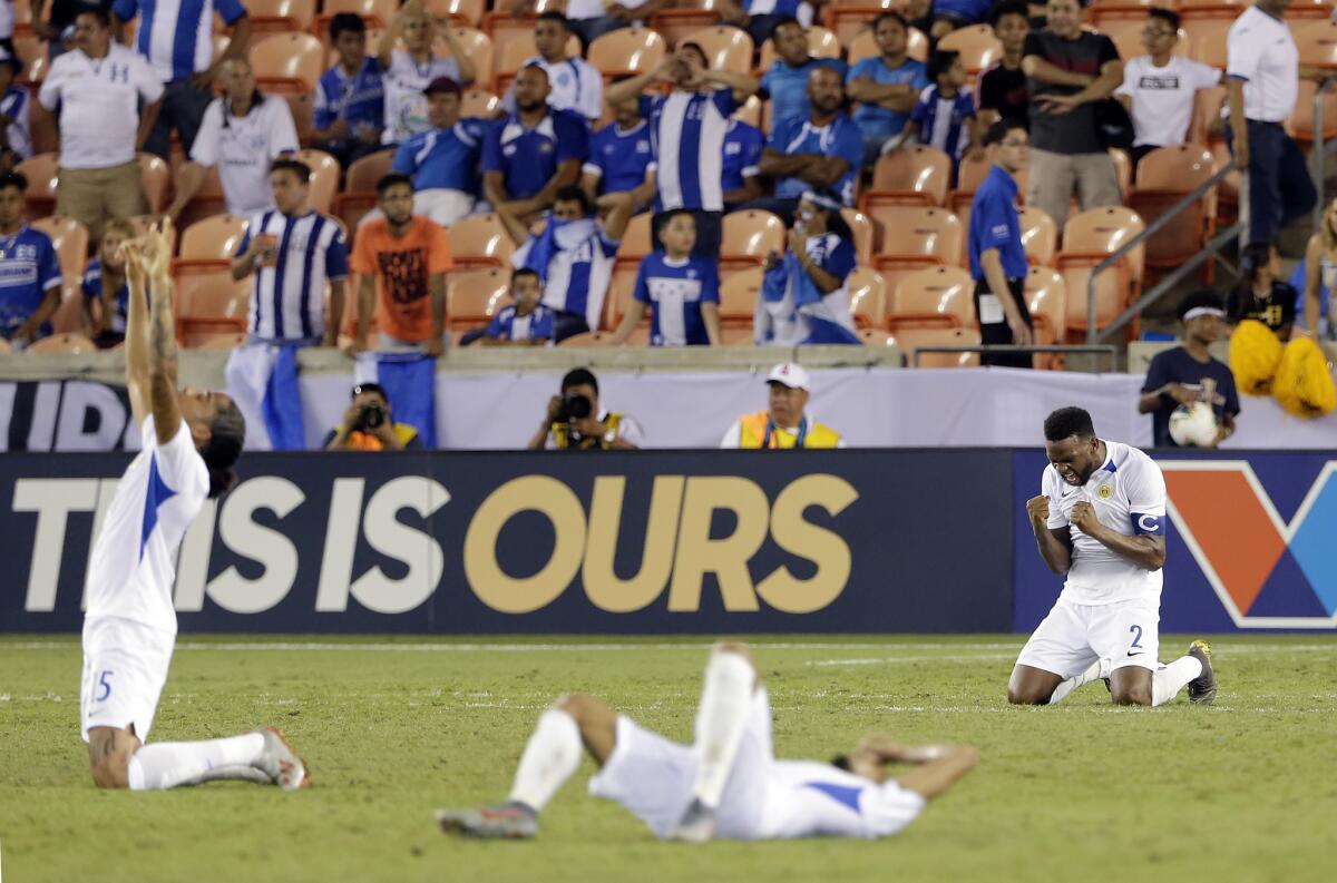 Curacao defender Jurich Carolina left, forward Jarchino Antonia, center, and Curacao defender Cuco Martina (2) celebrate the team's 1-0 win against Honduras in a CONCACAF Gold Cup soccer match Friday, June 21, 2019, in Houston.