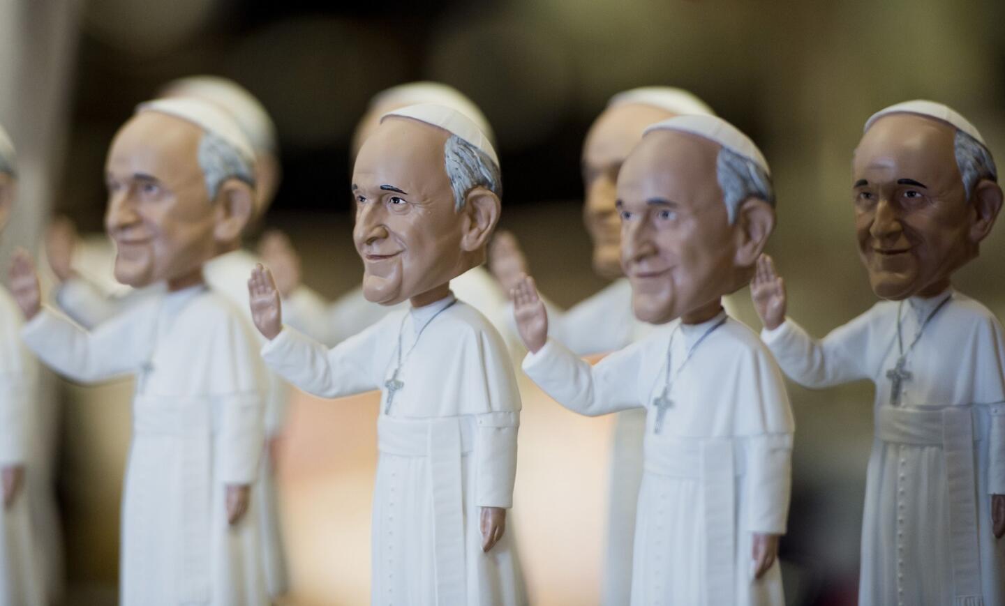 Pope Francis bobble-head dolls are displayed at a souvenir store in Washington.