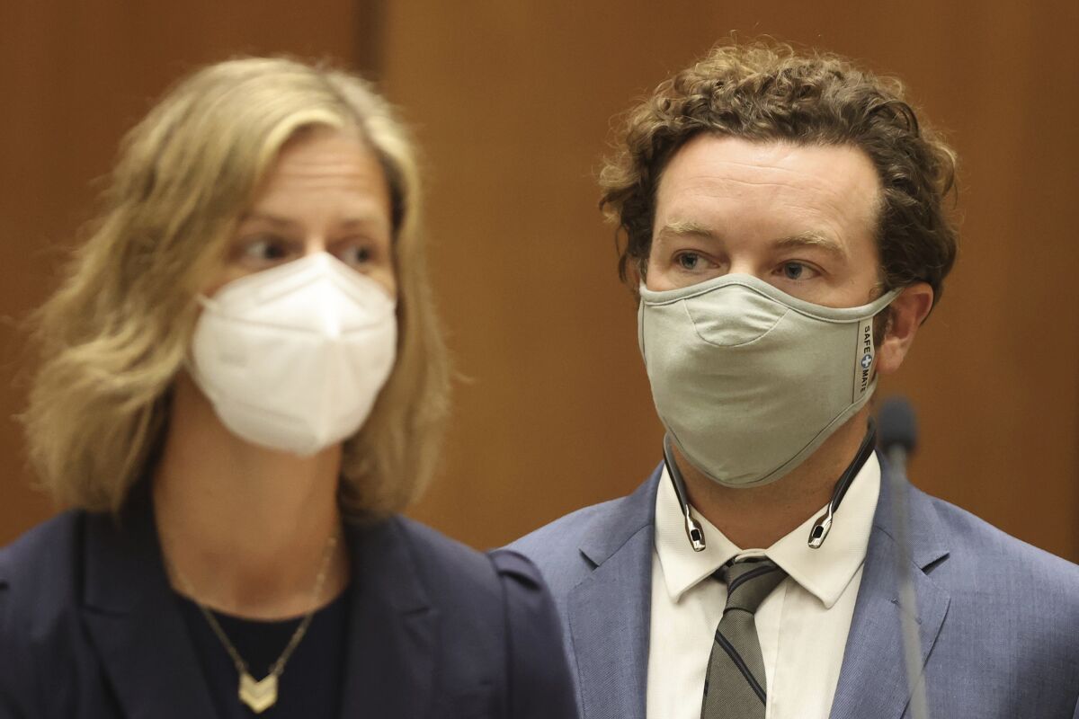 Danny Masterson stands in court with his lawyer.