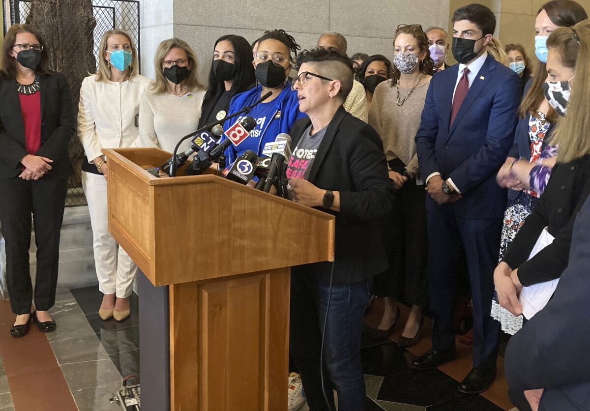 Gretchen Raffa of Planned Parenthood of Southern New England, Inc., appears with a group of Connecticut elected officials