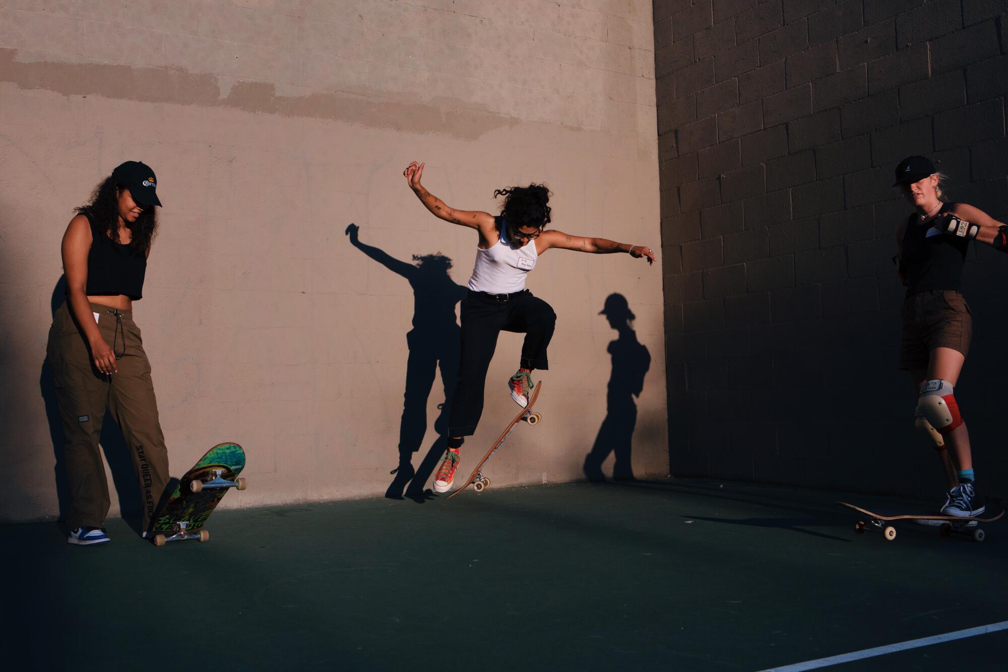 Cerise Castle (left), Boos Cruise founder, YaYa Chavez (center), and Torrie Krantz (right) skate