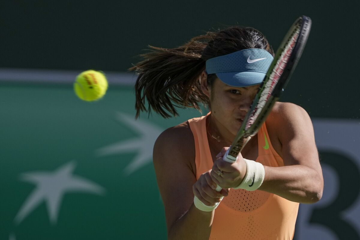 Emma Raducanu hits a return during her first-round win over Danka Kovinic.