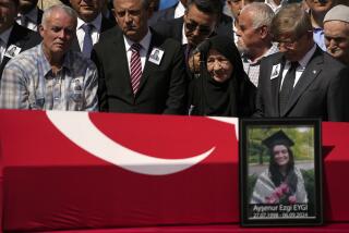 Mehmet, the father of Aysenur Ezgi Eygi, a 26 year-old Turkish-American activist killed by the Israeli military, left, attends prayers during his daughter's funeral outside the central mosque of Didim, Turkey, Saturday, Sept. 14, 2024,(AP Photo/Khalil Hamra)