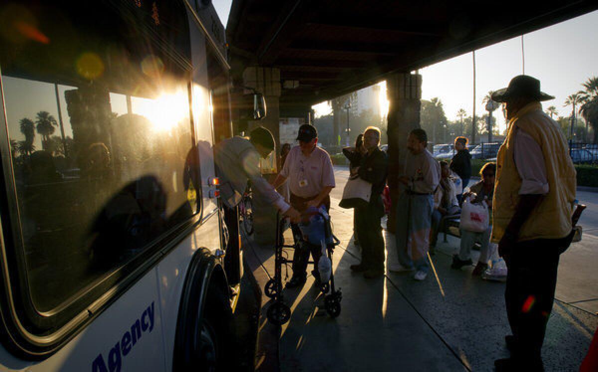 Americans took 10.5 billion trips on public transportation last year, 154 million trips more than 2011, a report said. Transit riders in Riverside board a bus.