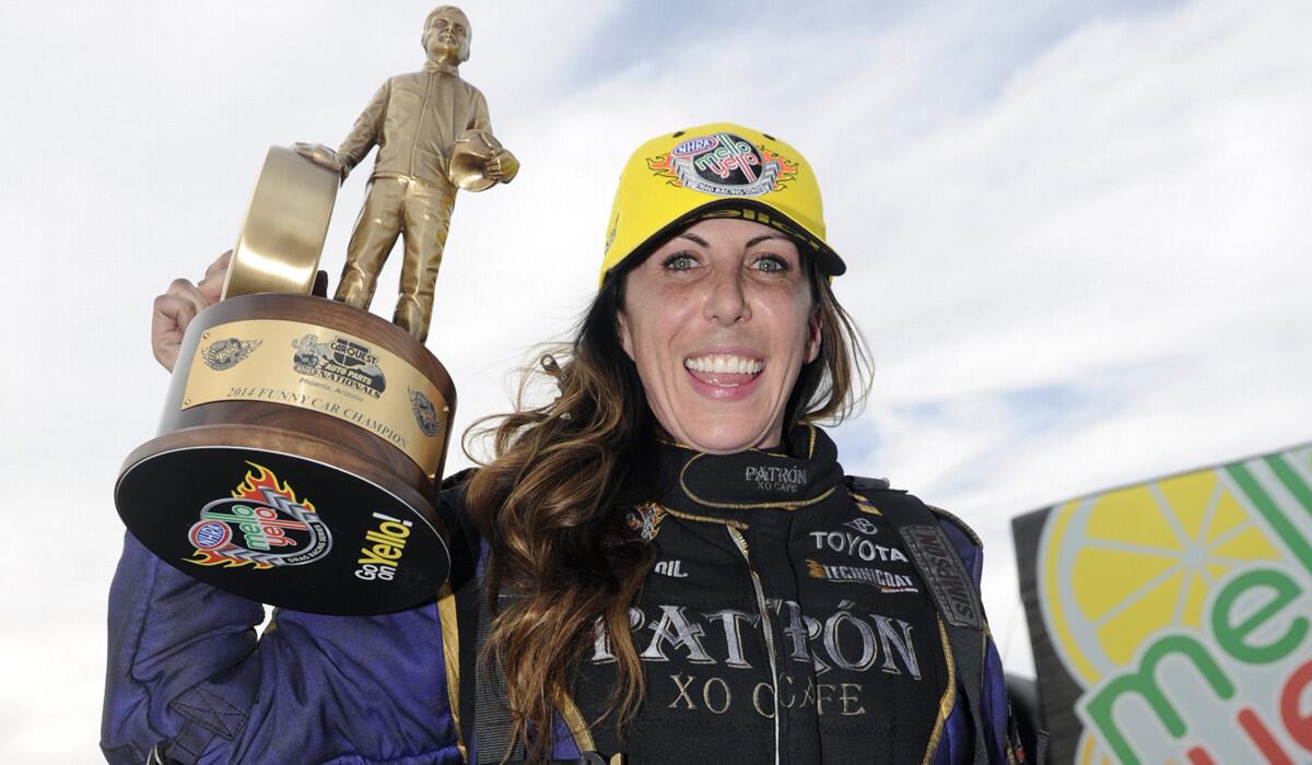 Alexis DeJoria celebrates her first funny car victory Feb. 23, 2014, in Phoenix, Ariz.