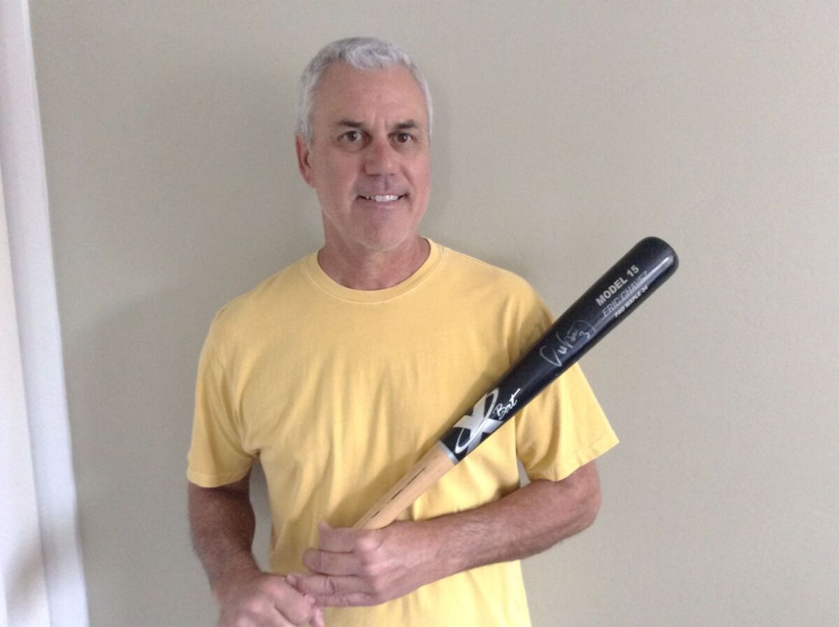 Jerry Haynal of Leucadia holds the autographed bat he received from Oakland third baseman Eric Chzvez.