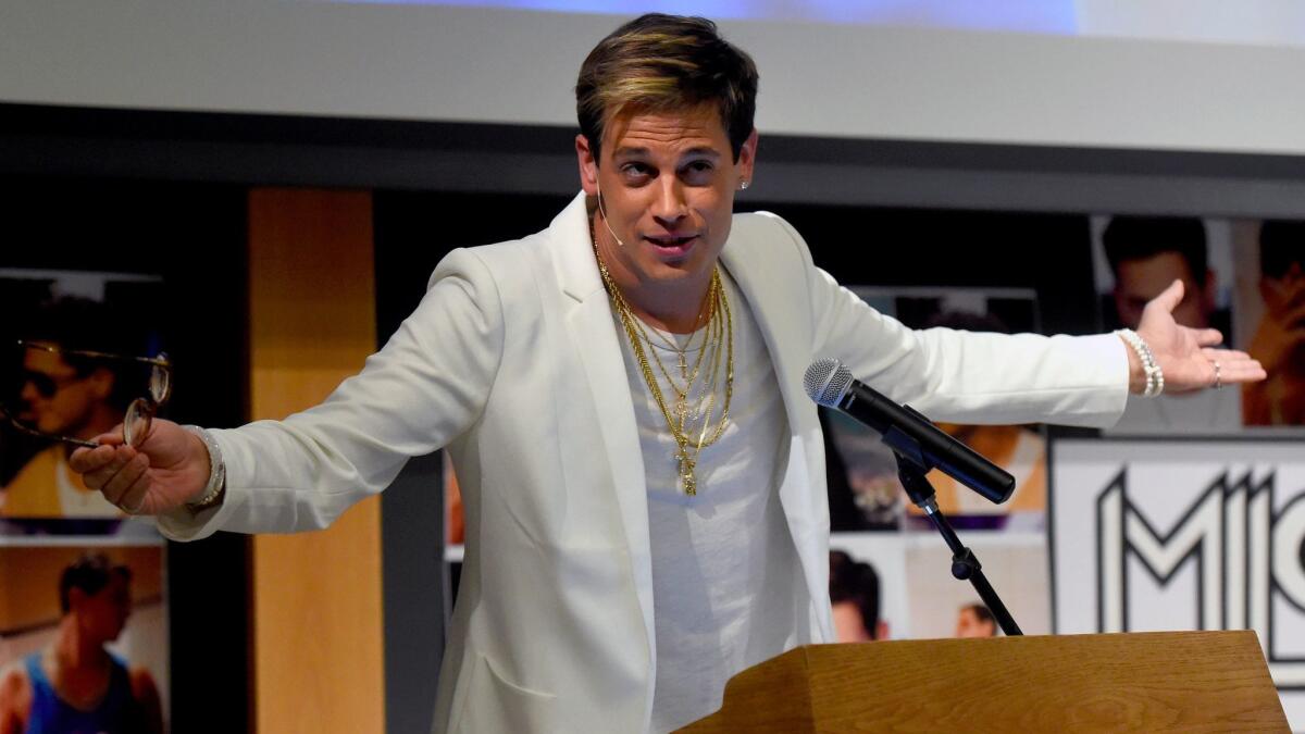 In this Jan. 25, 2017 photo, Milo Yiannopoulos speaks on campus in the Mathematics building at the University of Colorado in Boulder, Colo.