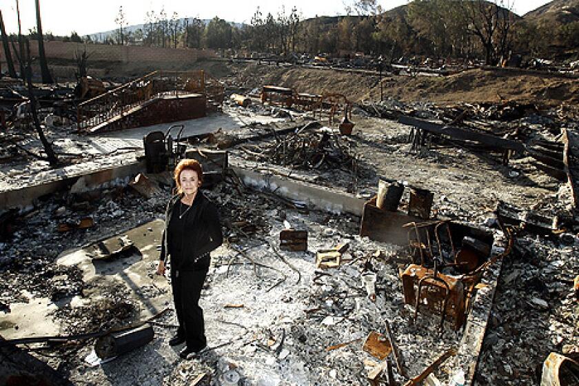 Manager Ginny Harmon lost everything in the Oakridge Mobile Home Park fire, but less than two months after the blaze destroyed or badly damaged more than 500 of the 600 homes there, she's doing everything she can to help all the residents get back on their feet.