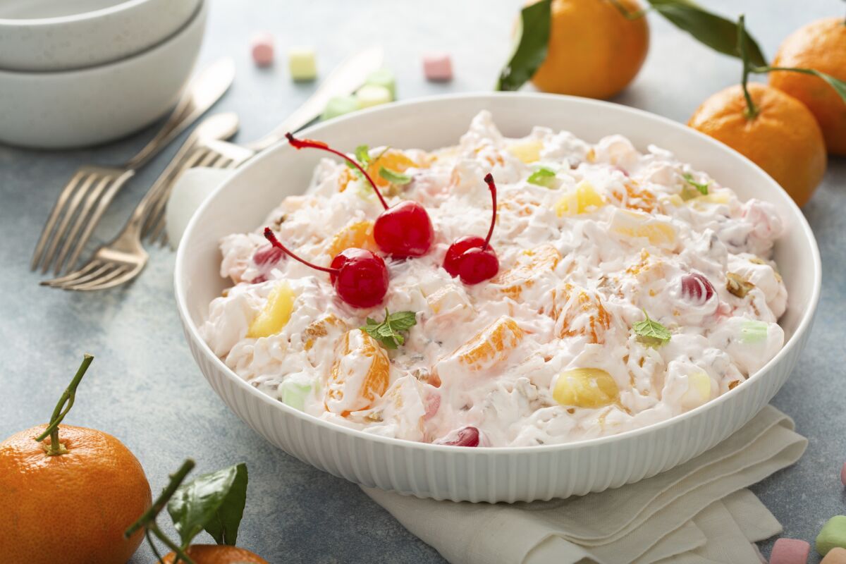 Ambrosia with cherries, pineapple and oranges in a bowl
