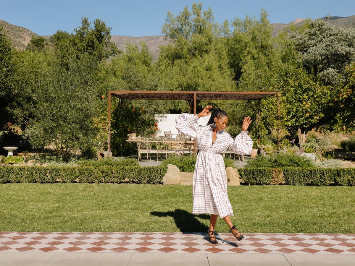 Fatima Robinson shows some moves in the yard of her Ojai home.