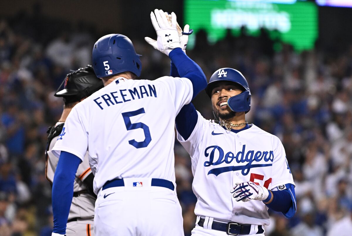 Dodgers' Mookie Betts celebrates his solo home run against the San Francisco Giants with Freddie Freeman.