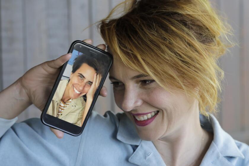 LOS ANGELES, CA - AUGUST 04: Amy Seimetz's second feature, "She Dies Tomorrow," had its premiere at the Vineland Drive-In. She and fellow filmmaker Kris Rey, (on phone) who is a close friend, had movies coming out the same day. Photographed in Mt. Washington on Tuesday, Aug. 4, 2020 in Los Angeles, CA. (Myung J. Chun / Los Angeles Times)