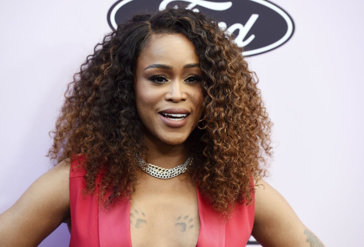 FILE - Eve poses at the 13th annual ESSENCE Black Women in Hollywood Awards Luncheon on Feb. 6, 2020, in Beverly Hills, Calif. The actor, singer and host of "The Talk" said she’s leaving the show in December to focus on expanding her family. (AP Photo/Chris Pizzello, File)