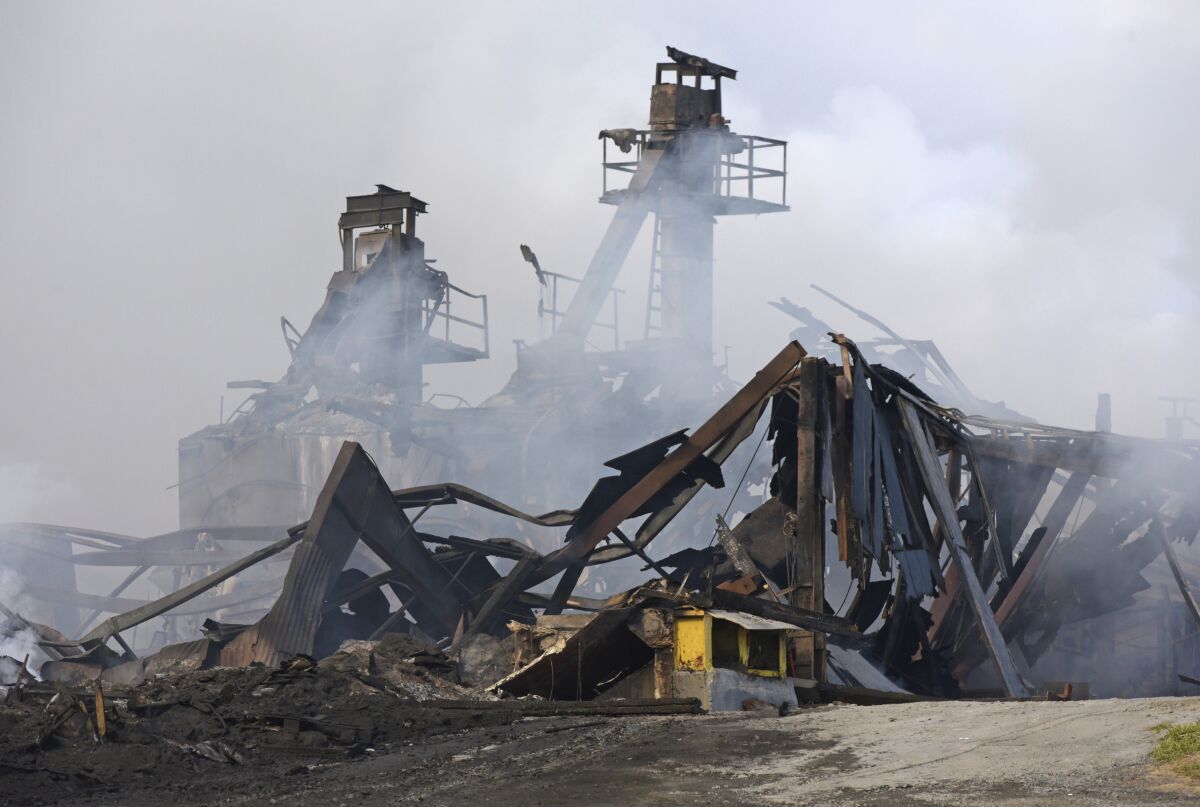The Winston Weaver Co. fertilizer plant in Winston-Salem, N.C., continues to burn, Wednesday, Feb. 2, 2022, after the fire started Monday night. Fire officials said they could not predict when the blaze might die down. And they didn't know how many people have actually obeyed the evacuation order. (Walt Unks/The Winston-Salem Journal via AP)