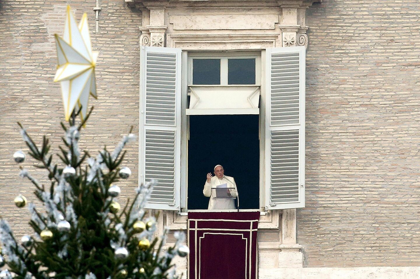 Pope Francis has a front row seat to this Christmas tree in Saint Peter's Square. He looks so close he can almost touch it...