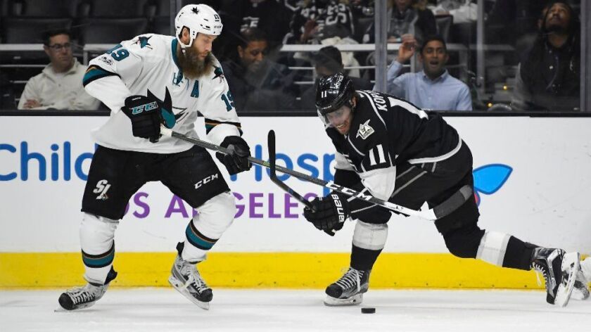 Sharks center Joe Thornton and Kings center Anze Kopitar battle for the puck during a game on Jan. 18.