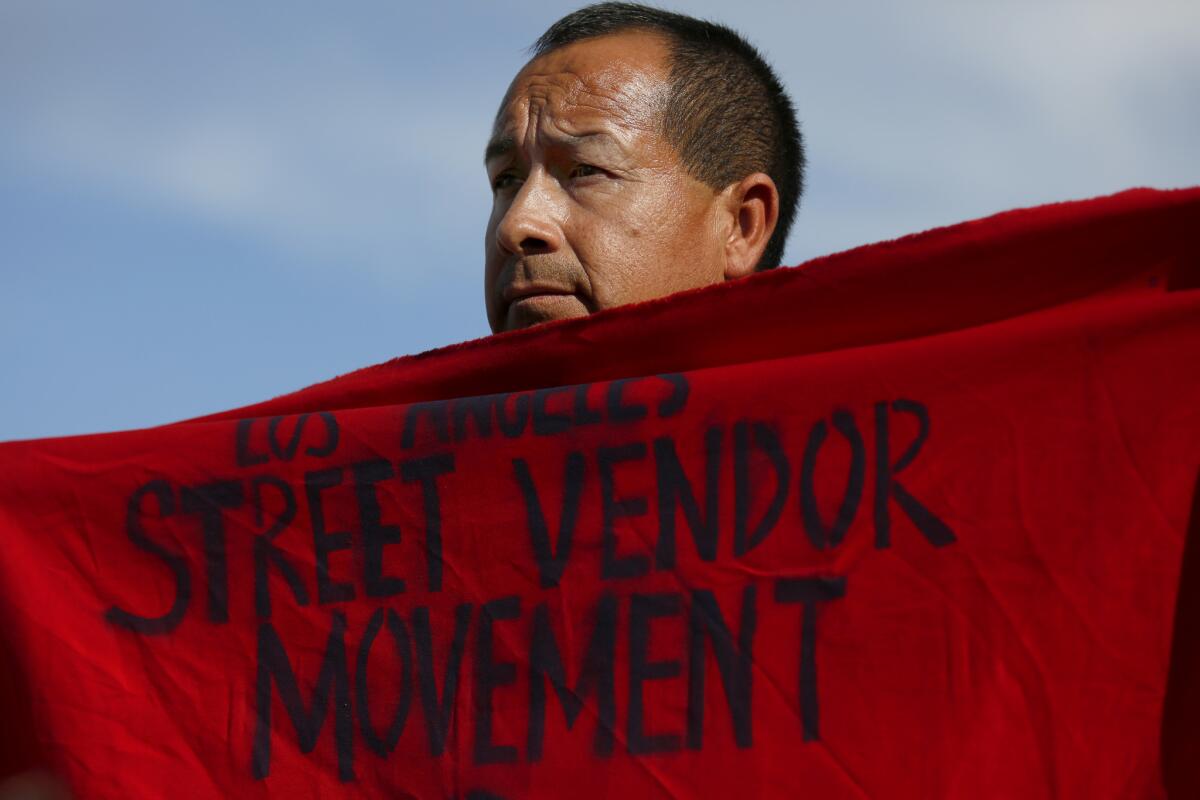 Irrael Trejo, 43, was among the dozens of people who participated in Thursday's march and rally for Benjamin Ramirez, the street vendor who recorded a man tipping over his cart. The rally also called on city officials to legalize street vending.