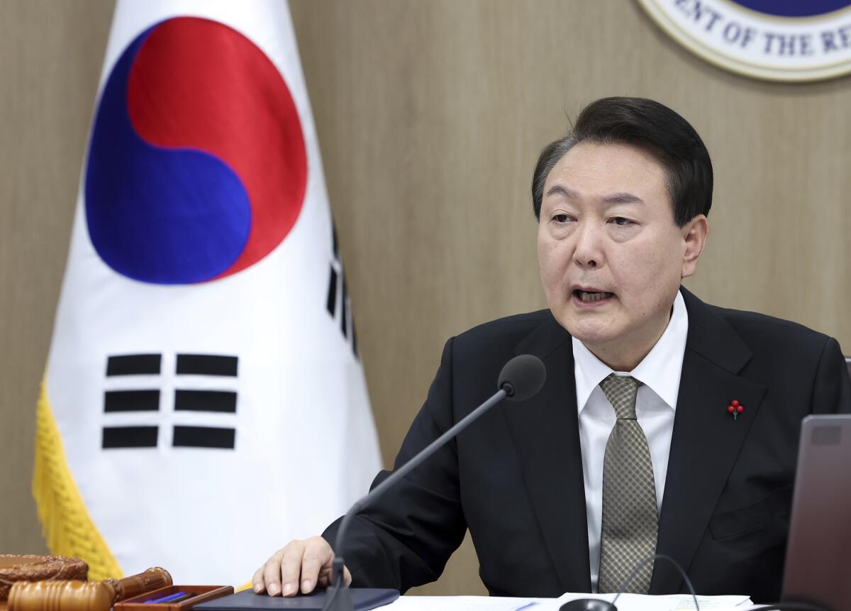 South Korean President Yoon Suk-yeol speaks during a meeting.