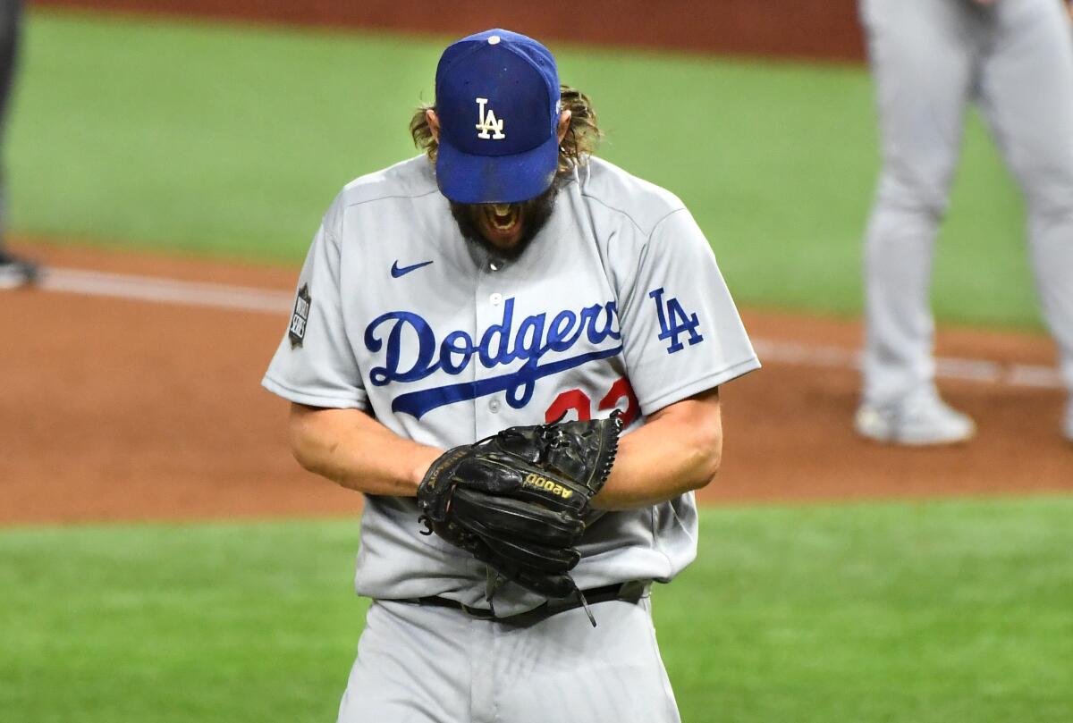 Dodgers pitcher Clayton Kershaw reacts after giving up a run-scoring single to Tampa Bay's Randy Arozaerna.