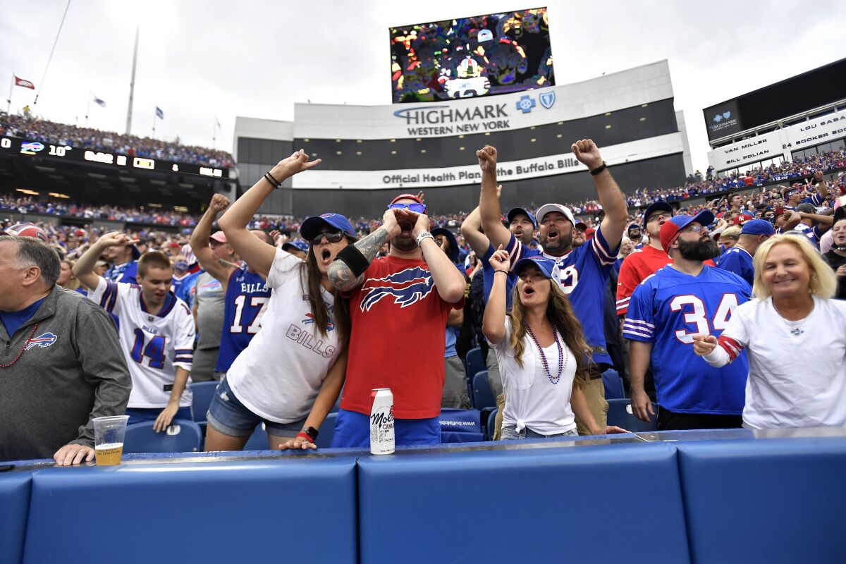Fans cheer during the second half of an NFL football game between the Buffalo Bills and the Pittsburgh Steelers in Orchard Park, N.Y., Sunday, Sept. 12, 2021. (AP Photo/Joshua Bessex)