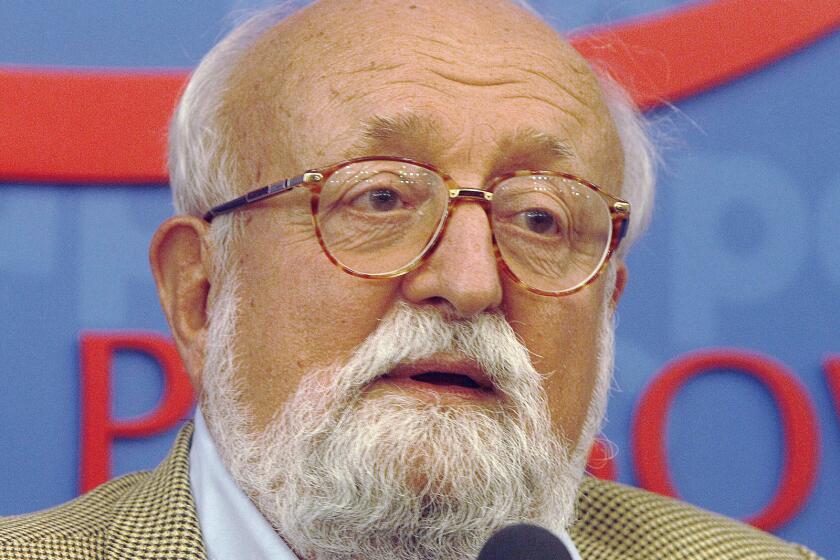 FILE - In this Sept. 16, 2013, file photo, Polish composer Krzysztof Penderecki tells a news conference in Warsaw, Poland. Sources close to the family say that Penderecki died Sunday at the age of 86 after a Òlong and serious illness.Ó (AP Photo/Czarek Sokolowski, File)