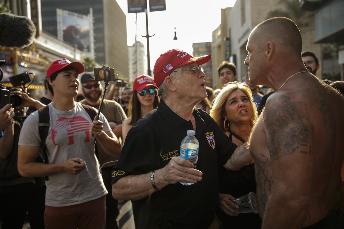 A Trump supporter argues with a protester.