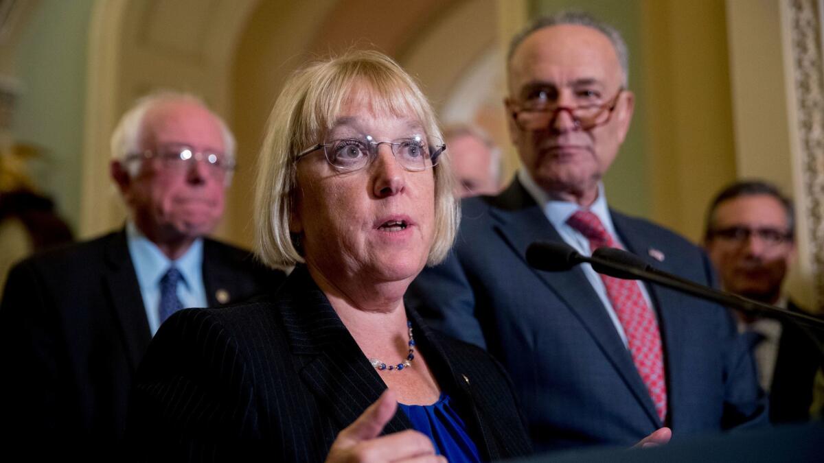 Sen. Patty Murray (D-Wash.) outlines a deal she reached with Sen. Lamar Alexander (R-Tenn.) on Obamacare funding that was terminated last week by President Trump. Sen. Bernie Sanders (I-Vt.) is in back and Senate Minority Leader Charles E. Schumer (D-N.Y.) is at right.