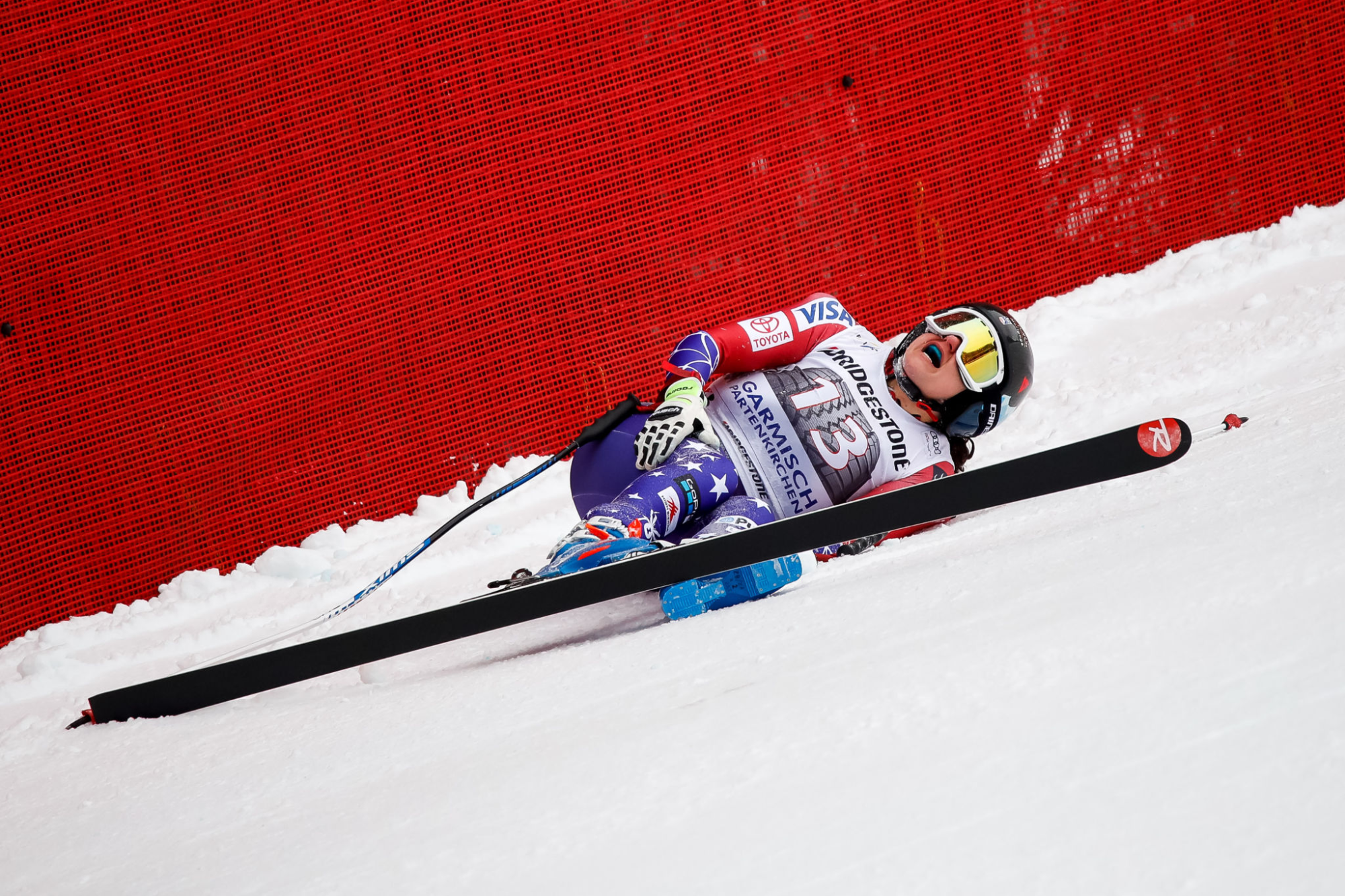 American skier Jackie Wiles clutches her leg after crashing in an FIS World Cup downhill race.