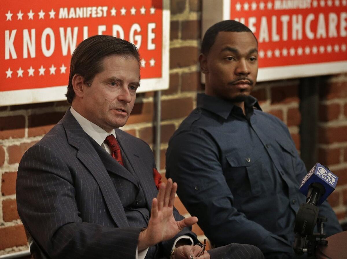 Attorney Christopher Dolan, left, representing the family of Jahi McMath, with Omari Sealey, Jahi's uncle, during a new conference this month. In a recent Times Op-Ed article, Dolan blasted critics of Jahi's family.