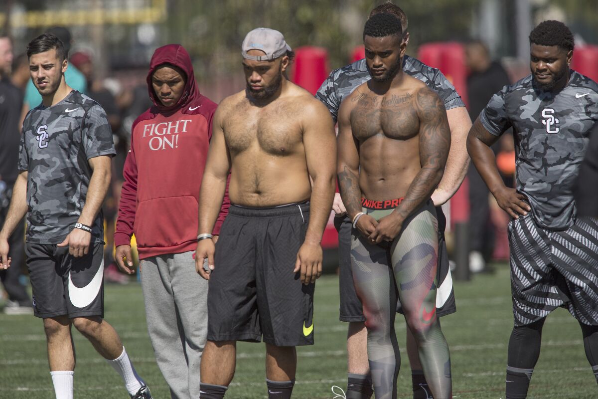 USC pro prospects line up to perform for NFL scouts during the Trojans' annual NFL pro day.