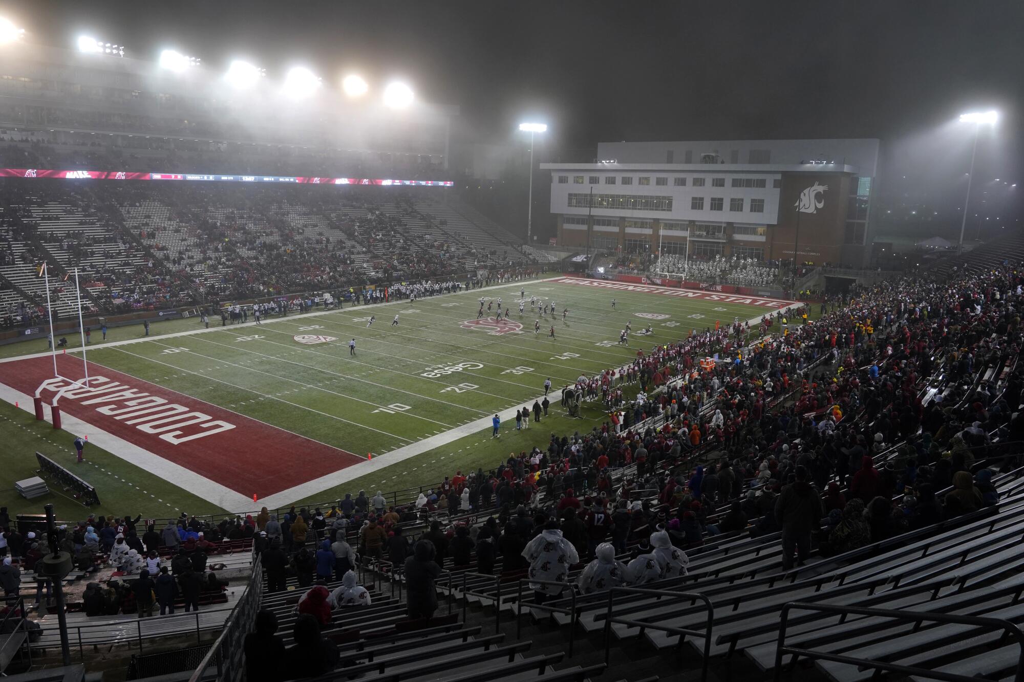 Light snow falls at Martin Stadium.