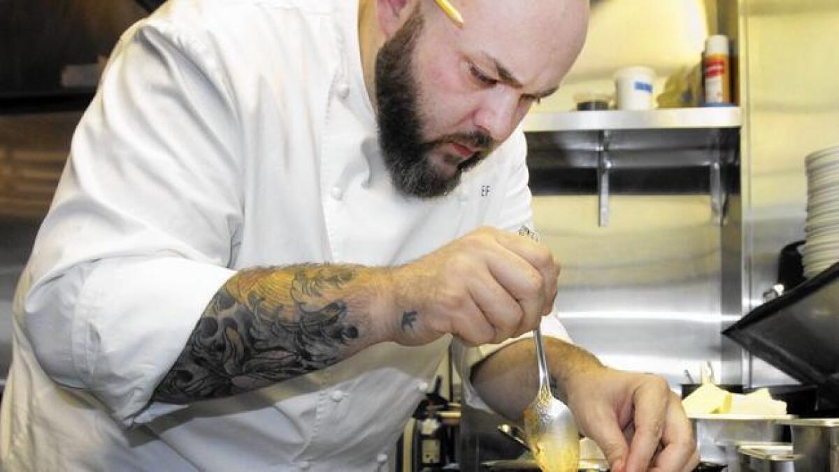 Evan Funke prepares a pasta dish in the kitchen of Bucato.