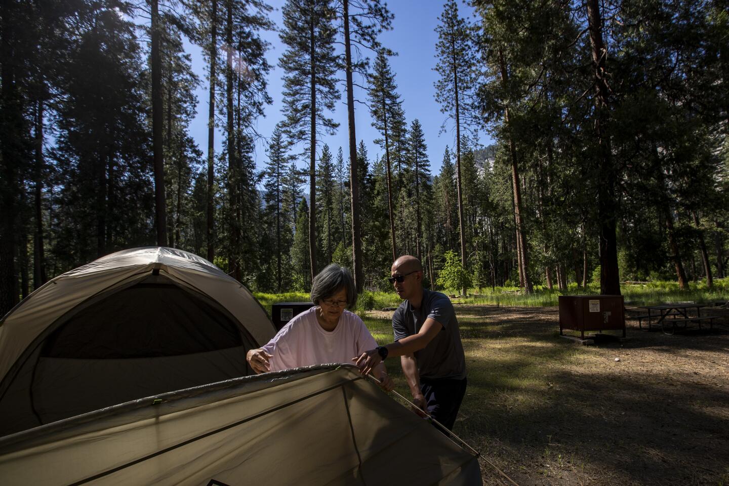 Gary Lin and his mother, May Lin, set up their tent in Upper Pines Campground.
