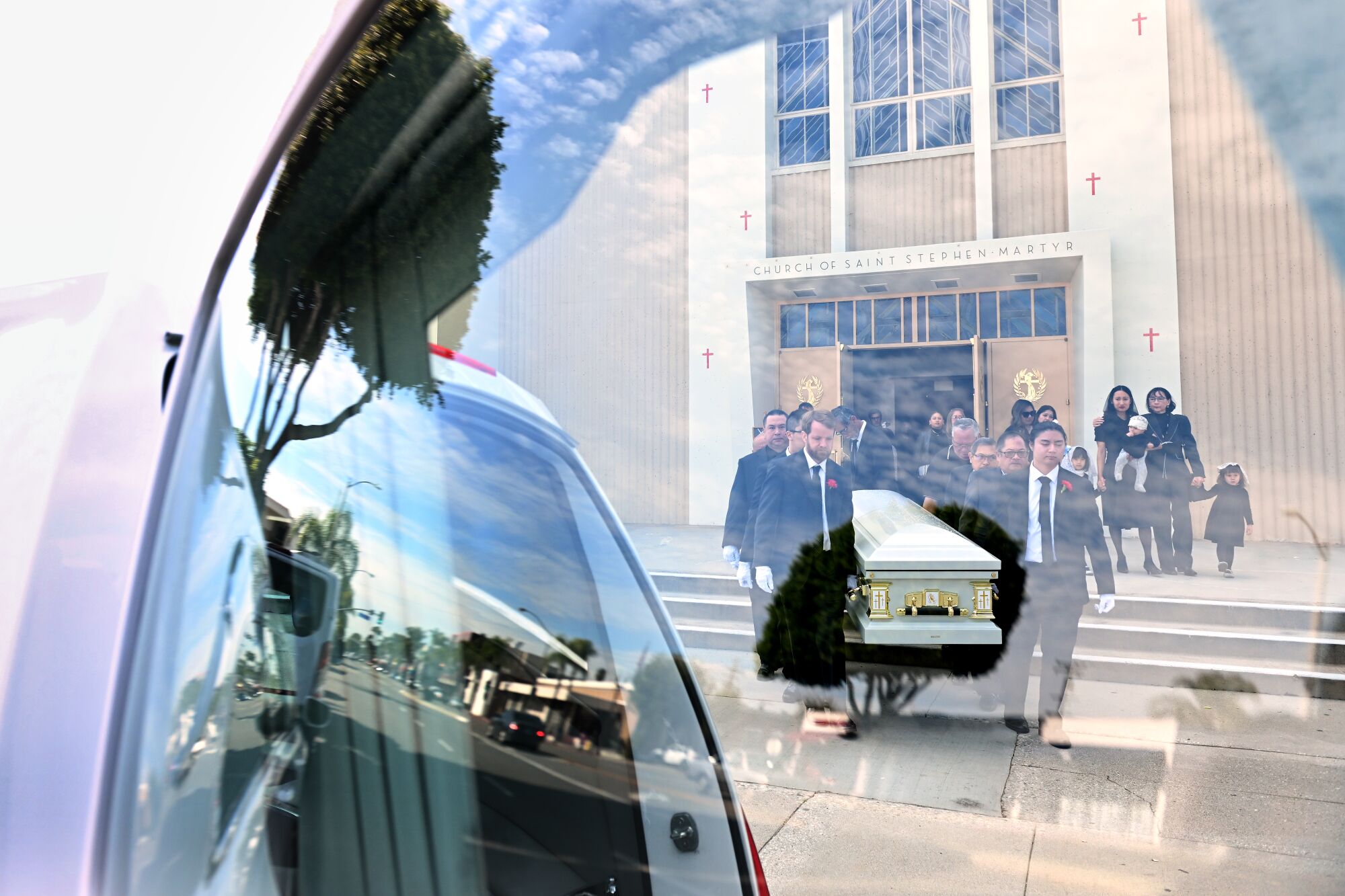Alvero's casket leaves St. Stephen Martyr Catholic Church.