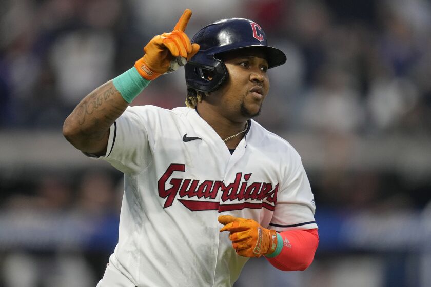 Cleveland Guardians' Jose Ramirez gestures while running to first after hitting his third home run of the night, during the sixth inning of the team's baseball game against the Boston Red Sox, Thursday, June 8, 2023, in Cleveland. (AP Photo/Sue Ogrocki)