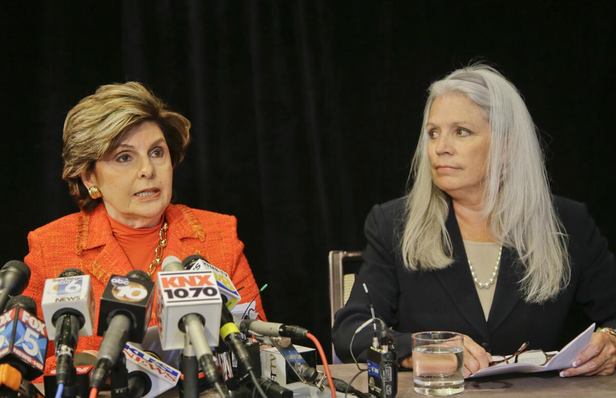 Attorney Gloria Allred, left, with her client, Irene McCormack Jackson, the former communications director for then-San Diego Mayor Bob Filner, speaks at a July news conference revealing the sexual harassment lawsuit against Filner.
