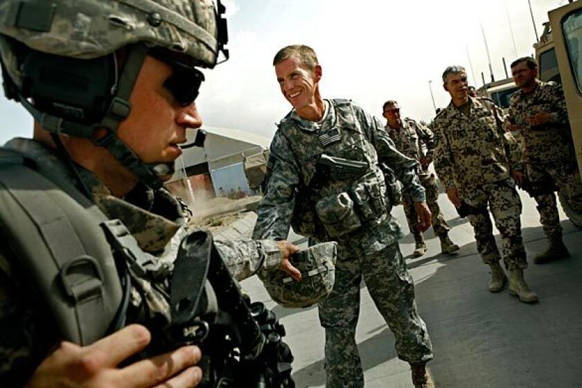 U.S. Gen. Stanley A. McChrystal arrives at Camp Kunduz in Kunduz province in northern Afghanistan, where he visits German troops serving in the NATO-led force.