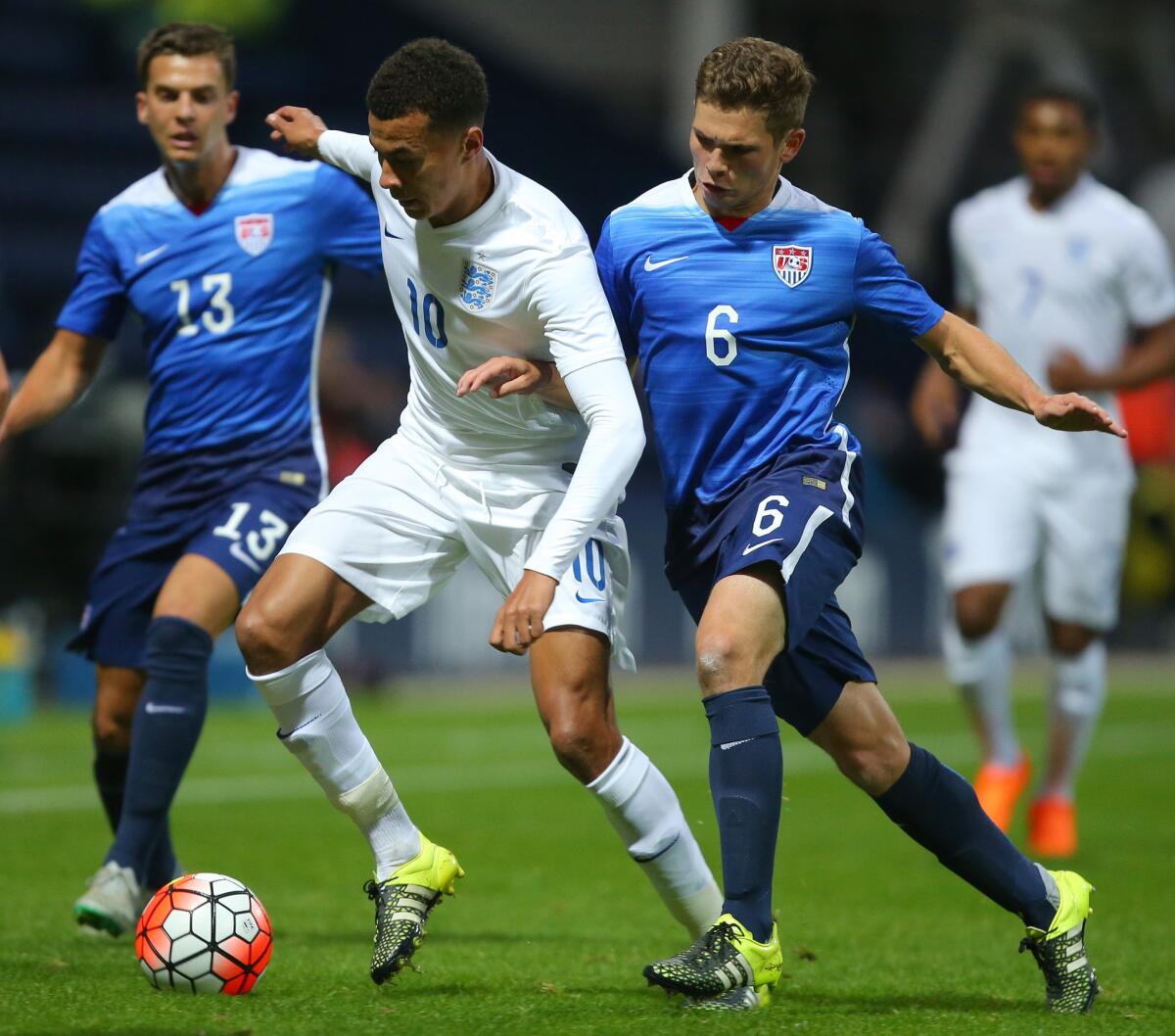 England's Dele Ali is challenged by Wil Trapp of USA during the International friendly match between England U21 and USA U23 on Sept. 3 in Preston, England.