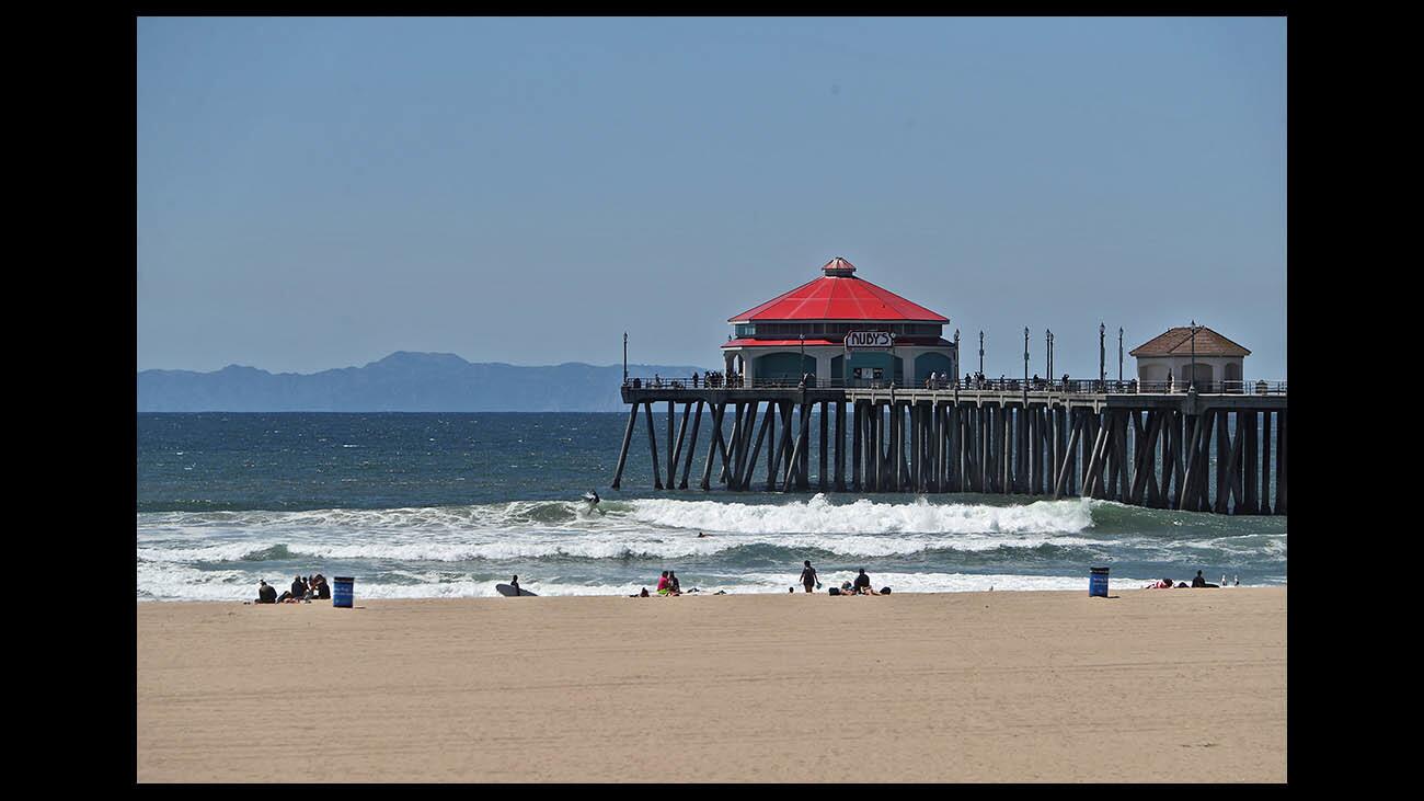 Catalina Island can be seen on a windy clear morning from the Huntington Beach pier, on Tuesday, April 17, 2018.