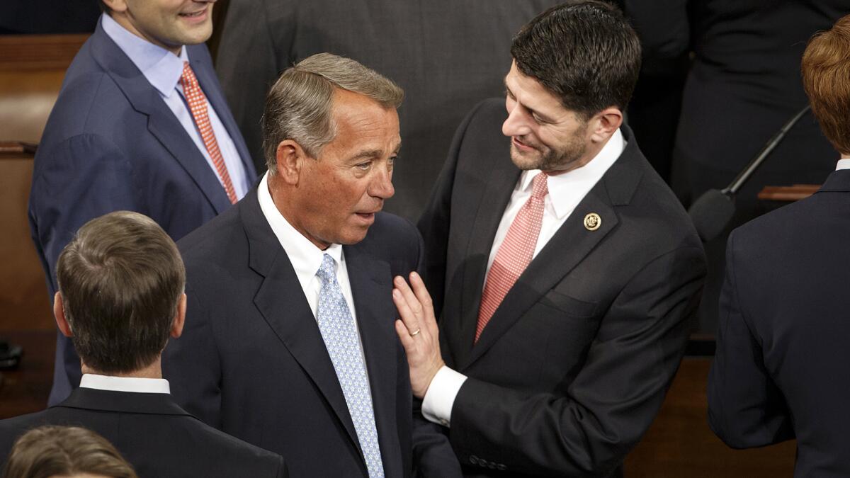 Rep. Paul Ryan, R-Wis., right, greets House Speaker John Boehner on Capitol Hill.